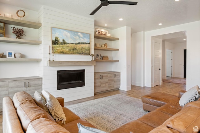 3322 S 2240 E, St George, UT 84790 - living area featuring recessed lighting, wood finished floors, ceiling fan, baseboards, and a fireplace