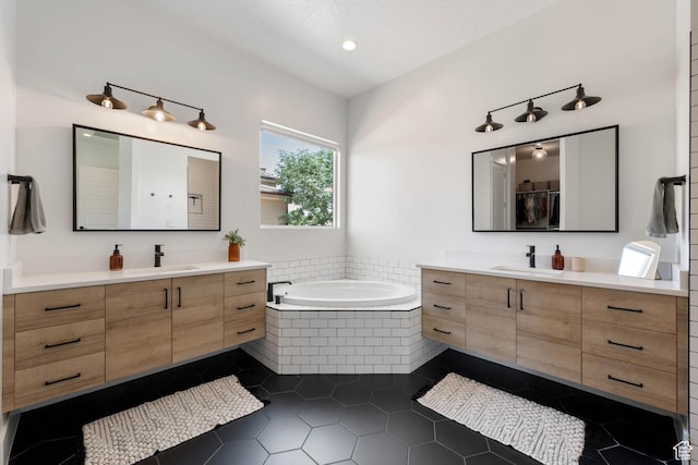 3322 S 2240 E, St George, UT 84790 - bathroom featuring two vanities, a bath, tile patterned flooring, and recessed lighting