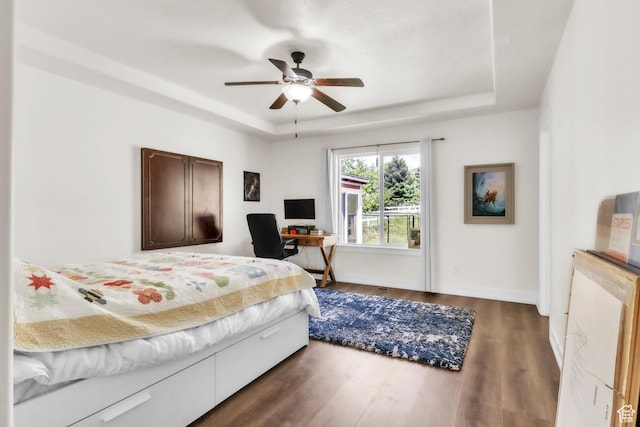 276 N Elk Ridge Dr, Elk Ridge, UT 84651 - bedroom featuring a raised ceiling, dark wood-type flooring, baseboards, ceiling fan, and an office area