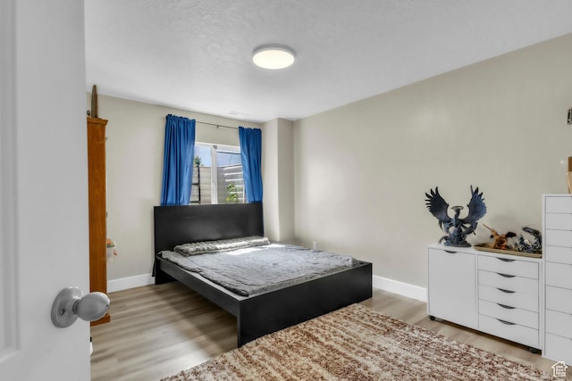 276 N Elk Ridge Dr, Elk Ridge, UT 84651 - bedroom featuring light wood finished floors and baseboards