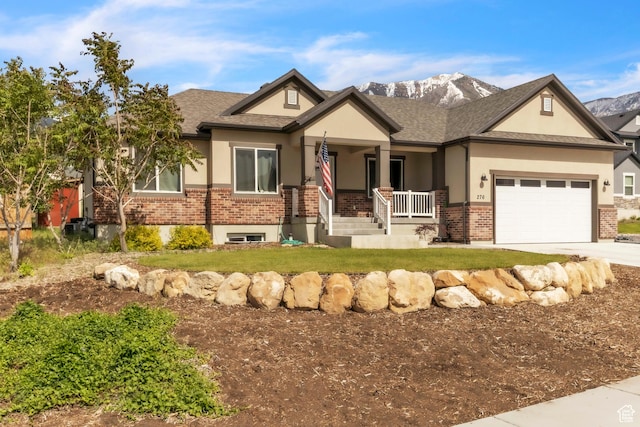 276 N Elk Ridge Dr, Elk Ridge, UT 84651 - view of front of property featuring a porch, brick siding, stucco siding, and concrete driveway