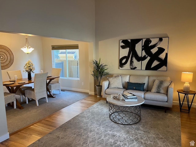 15146 S Walnut Grove Dr, Draper, UT 84020 - living area with baseboards, wood finished floors, and a high ceiling