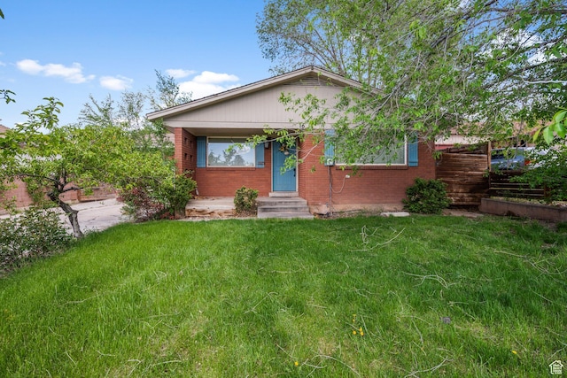 16 N 200 E, Cedar City, UT 84720 - bungalow-style home with brick siding, entry steps, and a front yard