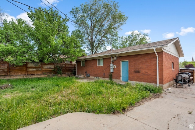 16 N 200 E, Cedar City, UT 84720 - rear view of house with brick siding and a patio