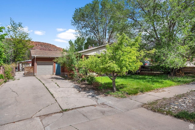 16 N 200 E, Cedar City, UT 84720 - obstructed view of property with an attached garage and driveway