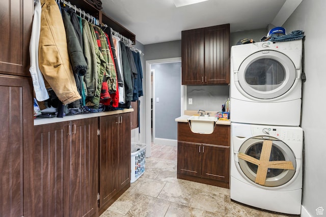 16 N 200 E, Cedar City, UT 84720 - laundry area with stacked washer and clothes dryer, cabinet space, and baseboards