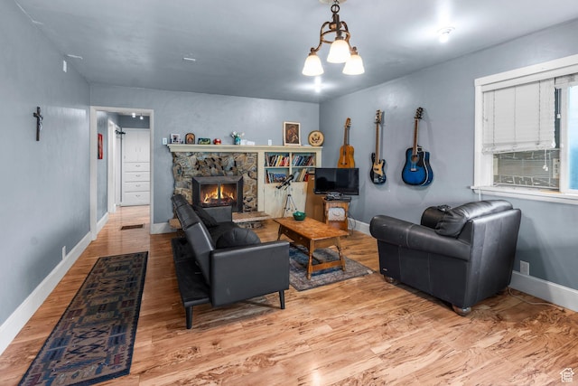 16 N 200 E, Cedar City, UT 84720 - living room with wood finished floors, baseboards, and a stone fireplace