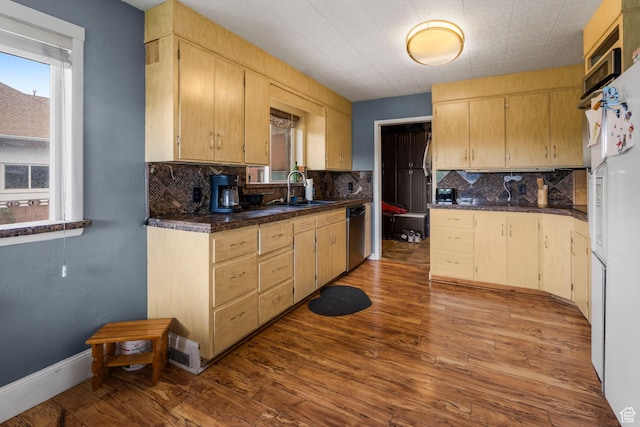 16 N 200 E, Cedar City, UT 84720 - kitchen featuring a sink, stainless steel dishwasher, dark wood-style flooring, dark countertops, and backsplash