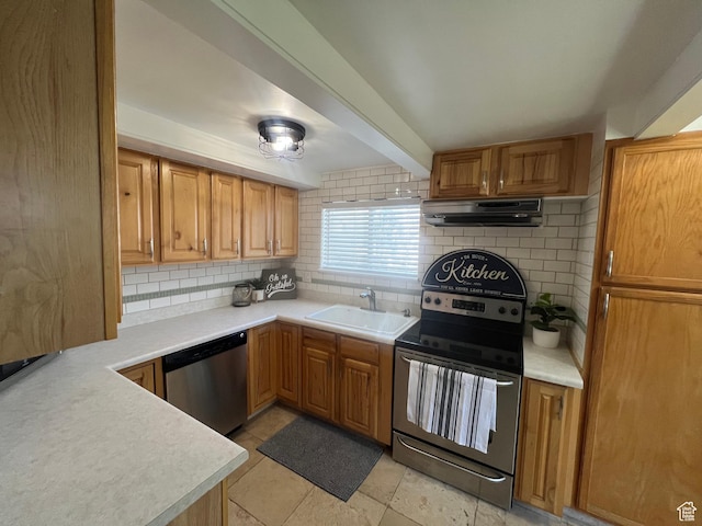 2717 S Orchard Dr, Bountiful, UT 84010 - kitchen with stainless steel appliances, a sink, extractor fan, decorative backsplash, and light countertops
