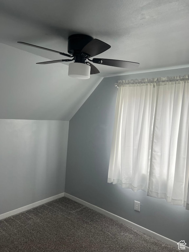 2717 S Orchard Dr, Bountiful, UT 84010 - additional living space featuring ceiling fan, vaulted ceiling, baseboards, and dark carpet