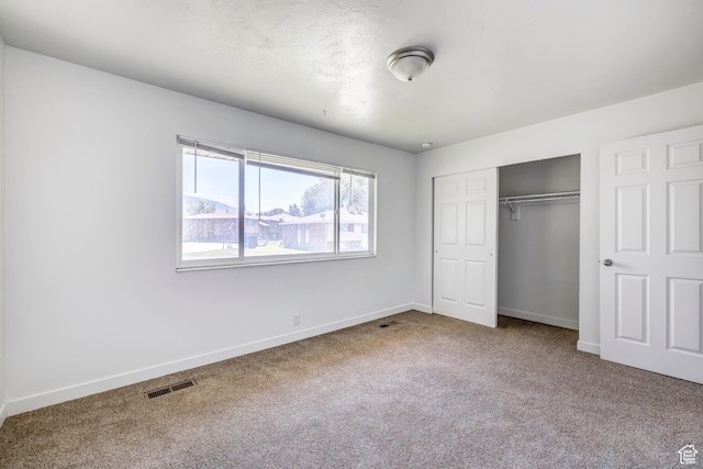 174 W Foxbridge Dr S, Midvale, UT 84047 - unfurnished bedroom featuring carpet floors, a closet, and baseboards