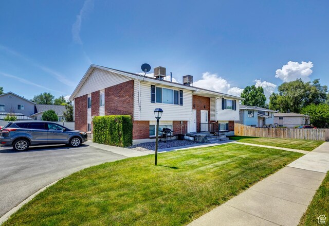 195 W 8480 S, Midvale, UT 84047 - view of front of property featuring brick siding and cooling unit