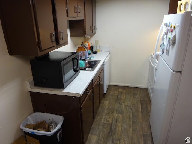 195 W 8480 S, Midvale, UT 84047 - kitchen with white appliances, dark wood-type flooring, light countertops, dark brown cabinets, and baseboards