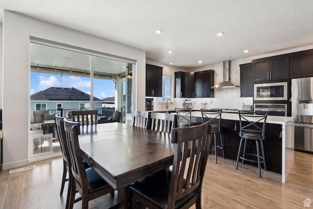 1006 W Firelock Way S, Bluffdale, UT 84065 - dining area with light wood-style flooring and recessed lighting