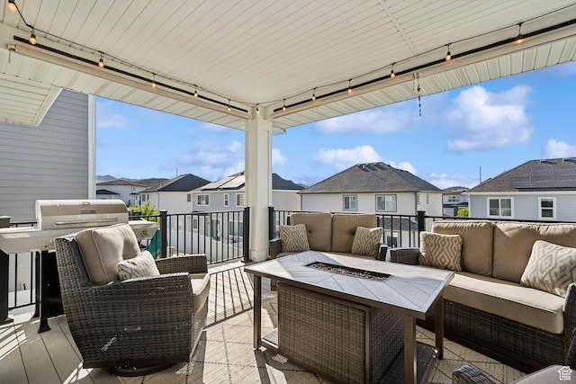 1006 W Firelock Way S, Bluffdale, UT 84065 - view of patio featuring an outdoor living space with a fire pit and a residential view