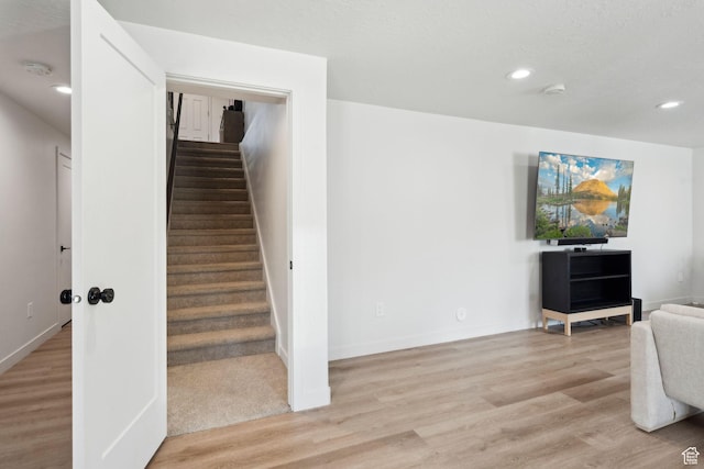1006 W Firelock Way S, Bluffdale, UT 84065 - stairway featuring wood finished floors, recessed lighting, and baseboards
