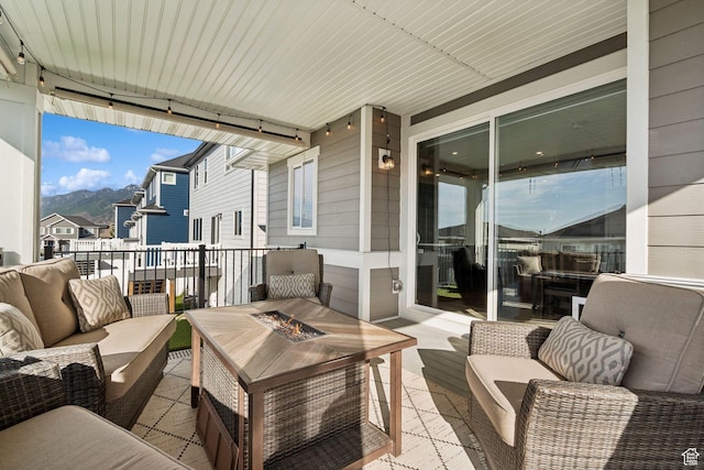 1006 W Firelock Way S, Bluffdale, UT 84065 - view of patio featuring an outdoor living space with a fire pit and a mountain view