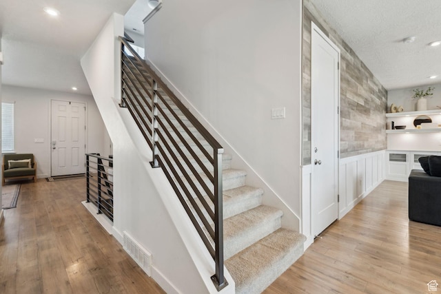 1006 W Firelock Way S, Bluffdale, UT 84065 - staircase with wood finished floors, recessed lighting, and a textured ceiling