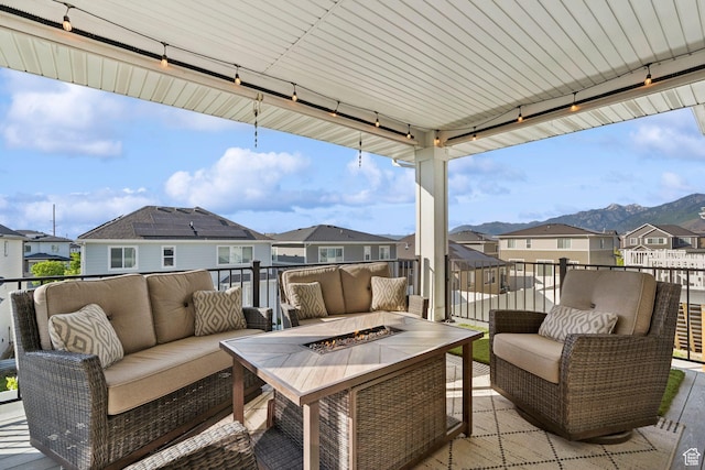 1006 W Firelock Way S, Bluffdale, UT 84065 - view of patio with a residential view, an outdoor living space with a fire pit, and a mountain view