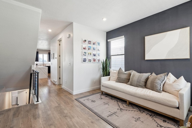 1006 W Firelock Way S, Bluffdale, UT 84065 - living area with wood finished floors, baseboards, and recessed lighting