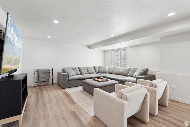 1006 W Firelock Way S, Bluffdale, UT 84065 - living area with light wood-type flooring, a textured ceiling, recessed lighting, and baseboards
