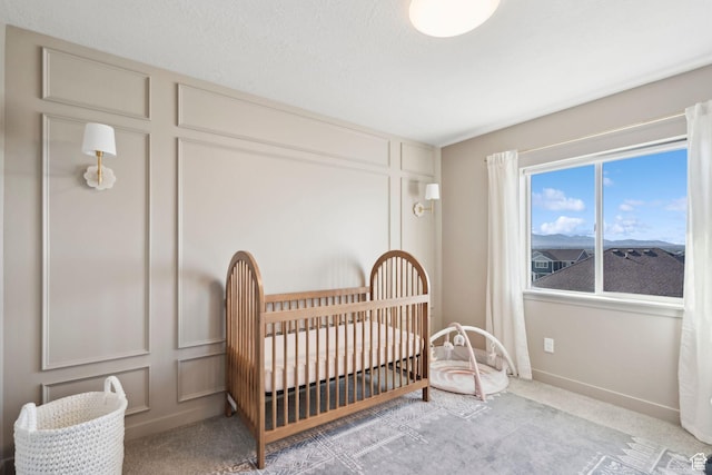 1006 W Firelock Way S, Bluffdale, UT 84065 - bedroom with a decorative wall, carpet, and a nursery area