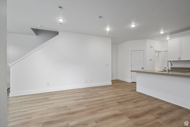 1766 W 160 S Unit 49, Pleasant Grove, UT 84062 - unfurnished living room with recessed lighting and light wood-style floors