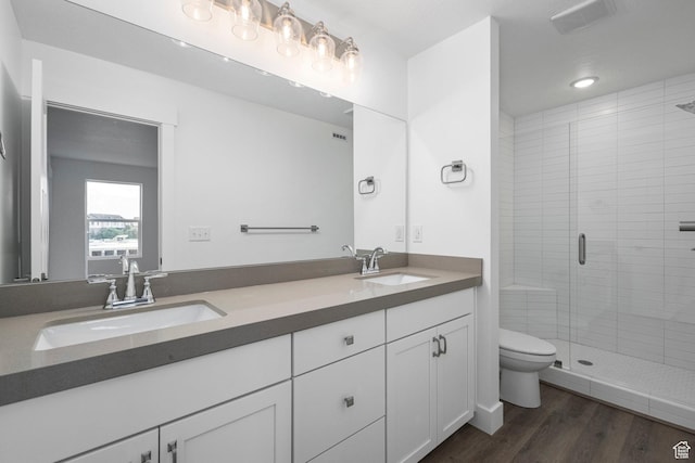1766 W 160 S Unit 49, Pleasant Grove, UT 84062 - bathroom featuring double vanity, a stall shower, and wood finished floors