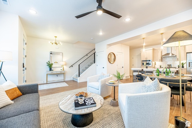4337 W 5430 S Unit D, Roy, UT 84067 - living area with stairs, light wood-type flooring, a chandelier, ceiling fan, and recessed lighting