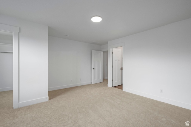 1776 W 160 S Unit 50, Pleasant Grove, UT 84062 - unfurnished bedroom featuring a walk in closet, carpet flooring, and a closet