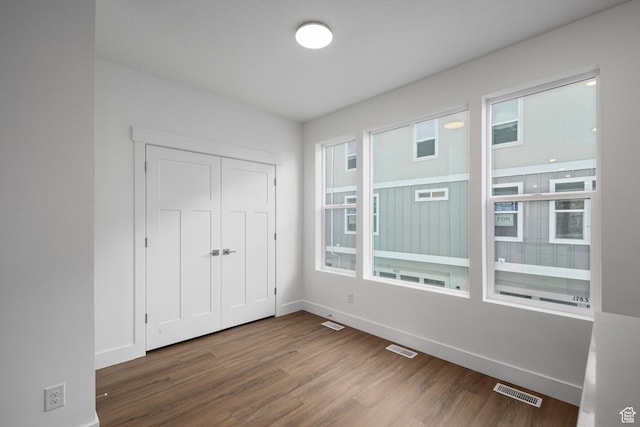1776 W 160 S Unit 50, Pleasant Grove, UT 84062 - unfurnished bedroom featuring dark wood-type flooring and a closet
