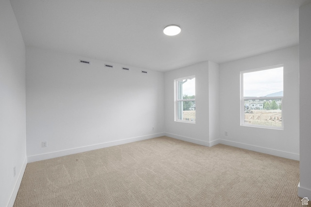 1776 W 160 S Unit 50, Pleasant Grove, UT 84062 - spare room featuring light carpet and baseboards