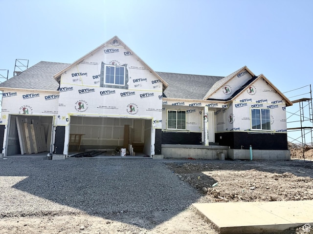 1044 S 3170 E Unit 219, Spanish Fork, UT 84660 - unfinished property featuring a shingled roof, a garage, and gravel driveway