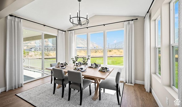 1044 S 3170 E Unit 219, Spanish Fork, UT 84660 - dining room with vaulted ceiling, a chandelier, baseboards, and wood finished floors