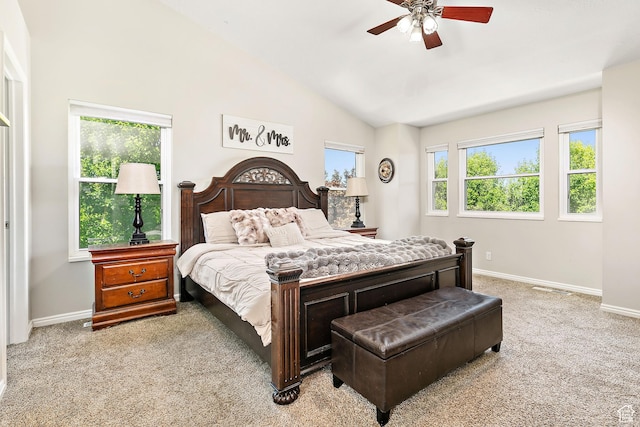 137 Stern Ct, Stansbury Park, UT 84074 - bedroom with light carpet, baseboards, lofted ceiling, and ceiling fan