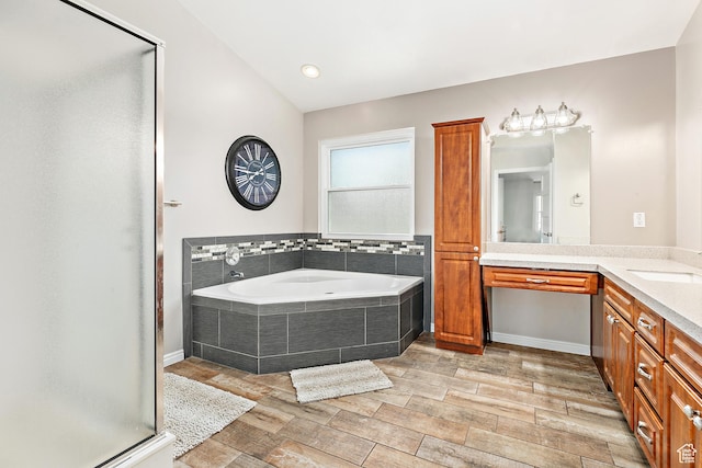 137 Stern Ct, Stansbury Park, UT 84074 - bathroom featuring vanity, a stall shower, a bath, and wood finished floors