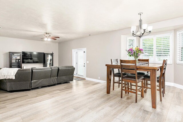 137 Stern Ct, Stansbury Park, UT 84074 - dining area with a chandelier, light wood-style floors, baseboards, and a ceiling fan