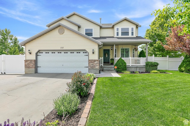 137 Stern Ct, Stansbury Park, UT 84074 - traditional home with covered porch, driveway, brick siding, and a garage