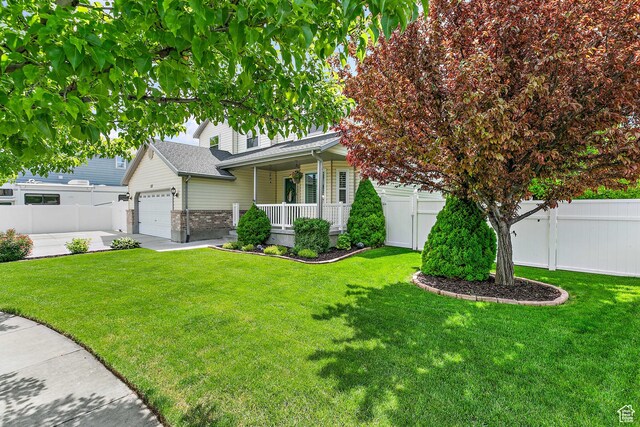 137 Stern Ct, Stansbury Park, UT 84074 - view of front of property with covered porch and a garage