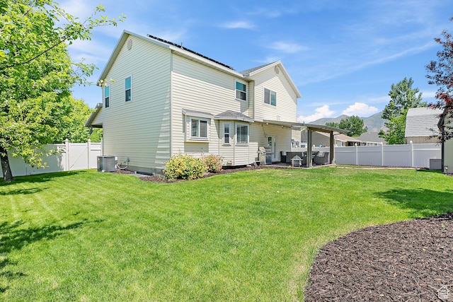 137 Stern Ct, Stansbury Park, UT 84074 - rear view of property with cooling unit and a mountain view