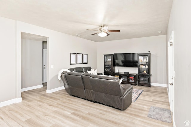 137 Stern Ct, Stansbury Park, UT 84074 - living area featuring ceiling fan, light wood-style floors, and baseboards