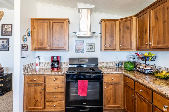 16 E Pearly Ln, La Sal, UT 84530 - kitchen with gas stove, wall chimney range hood, ornamental molding, brown cabinets, and light stone counters