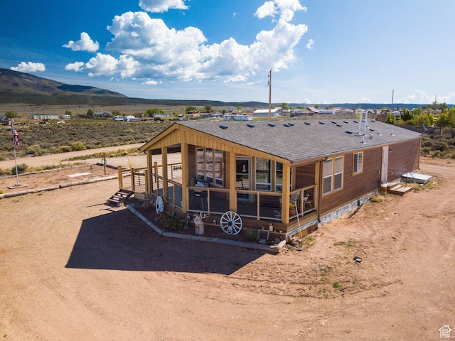16 E Pearly Ln, La Sal, UT 84530 - back of house featuring roof with shingles and a mountain view