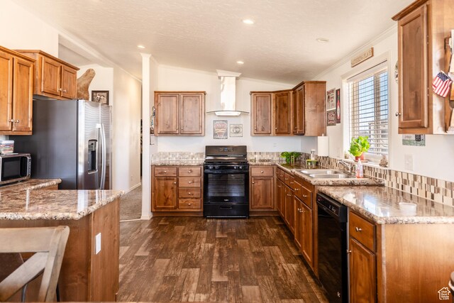 16 E Pearly Ln, La Sal, UT 84530 - kitchen with black appliances, wall chimney range hood, a sink, brown cabinets, and dark wood-type flooring