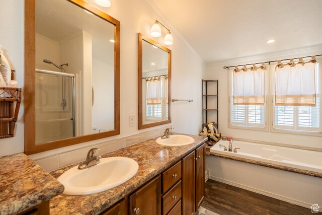 16 E Pearly Ln, La Sal, UT 84530 - full bath featuring wood finished floors, a shower stall, a garden tub, and double vanity