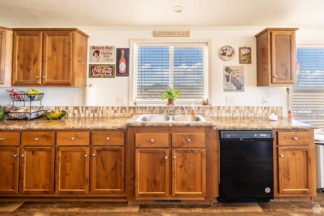 16 E Pearly Ln, La Sal, UT 84530 - kitchen with black dishwasher, dark wood-style flooring, brown cabinets, and crown molding