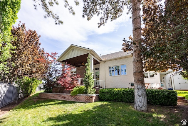 2590 E Olympus Dr, Holladay, UT 84124 - back of house with brick siding and ceiling fan