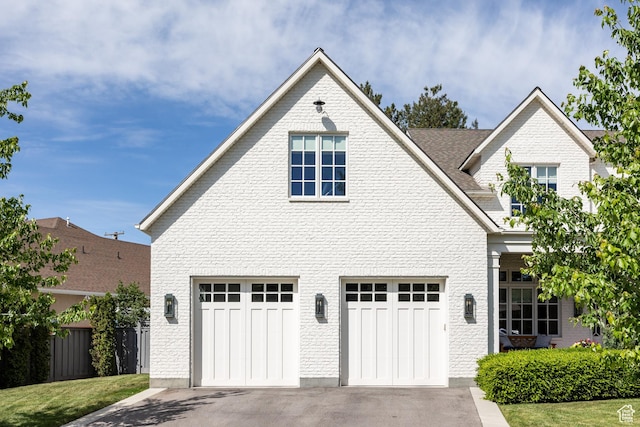 2590 E Olympus Dr, Holladay, UT 84124 - view of front of property with a garage, concrete driveway, and brick siding