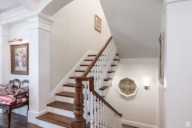 2590 E Olympus Dr, Holladay, UT 84124 - stairway featuring arched walkways, decorative columns, baseboards, and wood finished floors