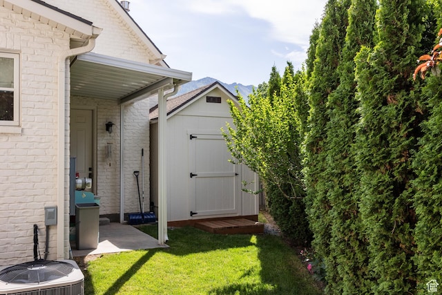 2590 E Olympus Dr, Holladay, UT 84124 - view of grassy yard featuring central AC